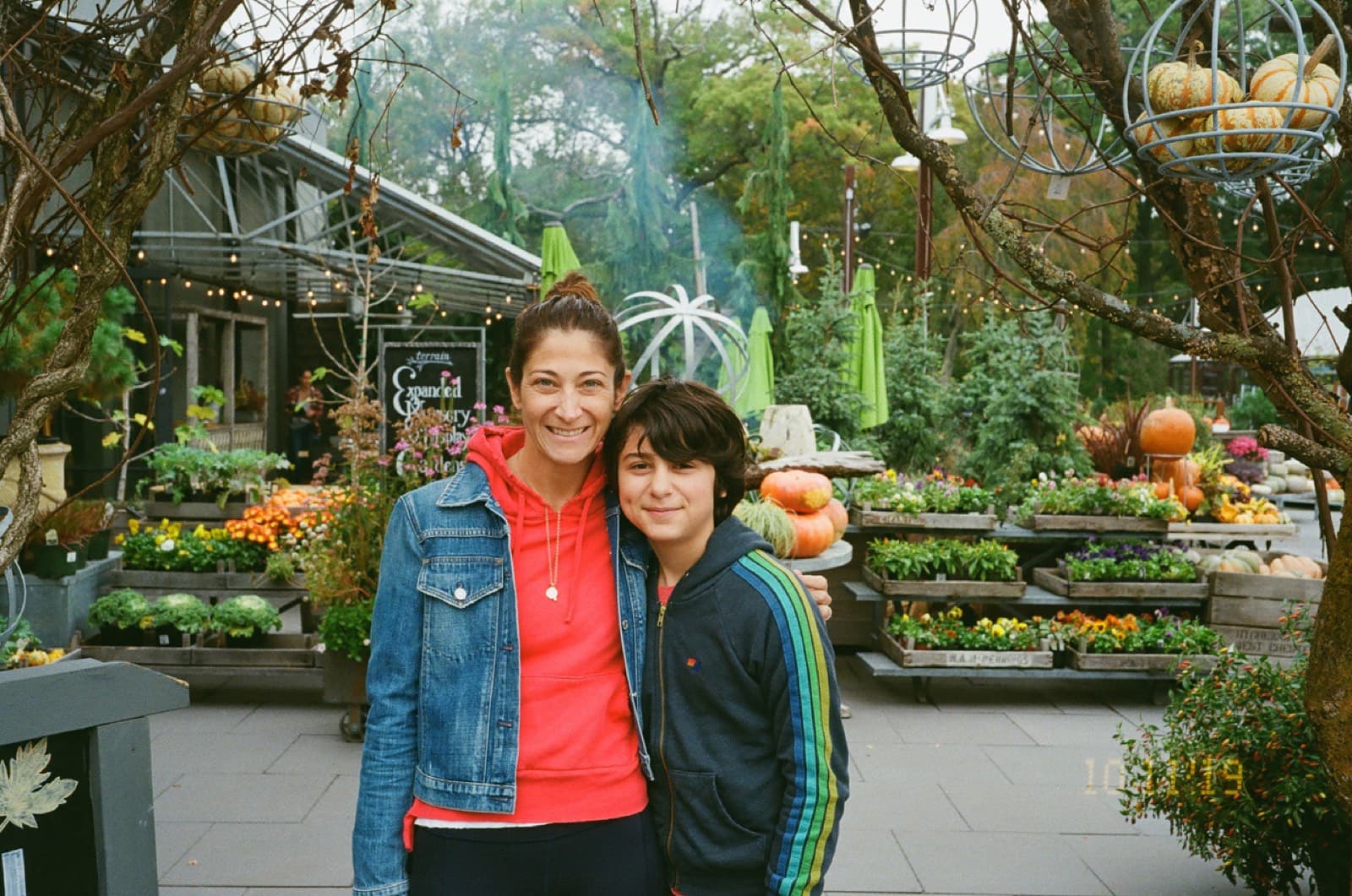 Mom and young Mack at a fall pumpkin patch.