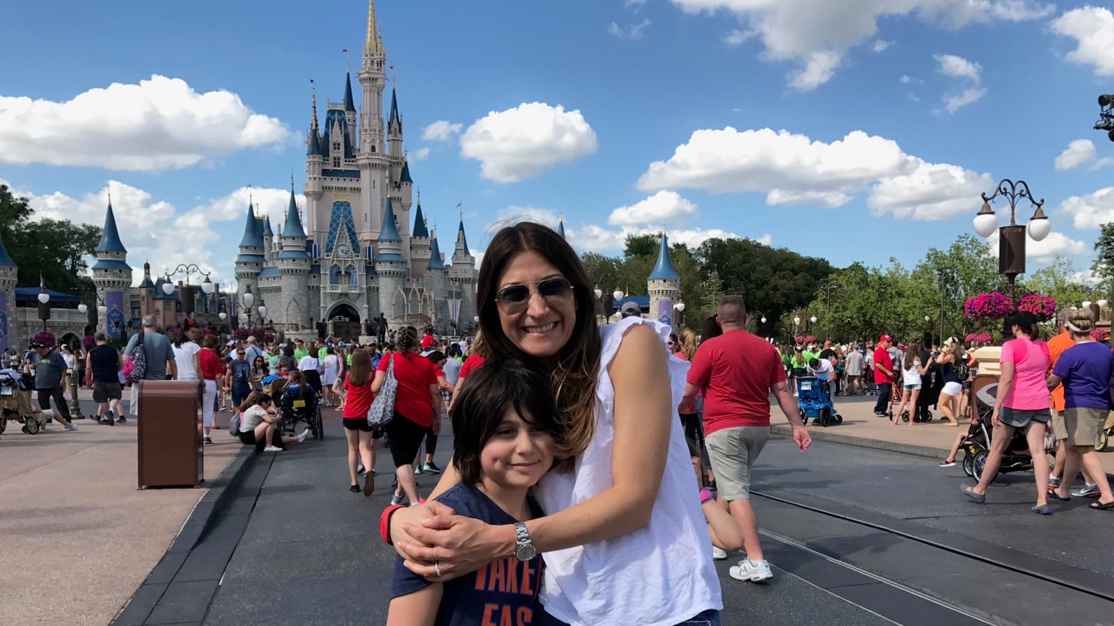 Mom and Mack at Disney World, castle behind.